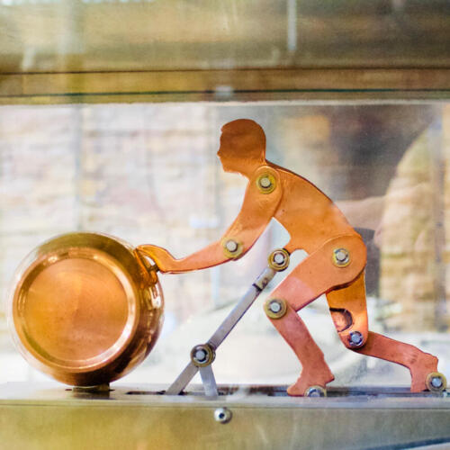 Walker Woodfill is the name of the copper man pushing his barrel inside the world's only whiskey-powered spirit safe.